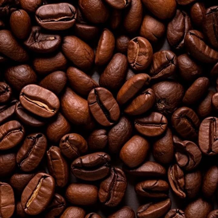Fresh roasted coffee beans in burlap sack